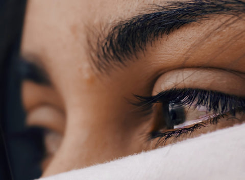 a woman with tears in her eyes