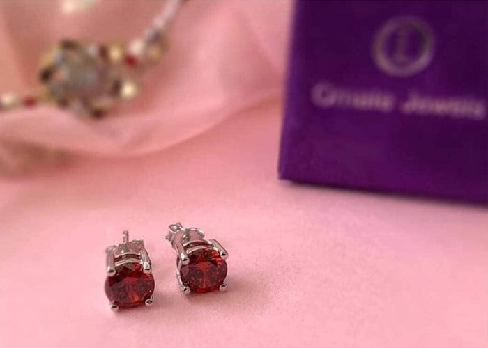 Pure silver ruby stud earrings for women and girls. Affordable rakhi gift for sisters online