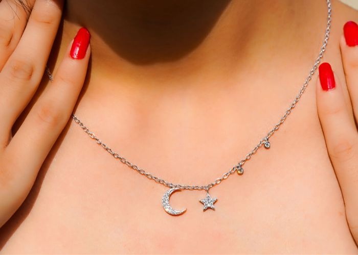 Moon and star pendant necklace in silver