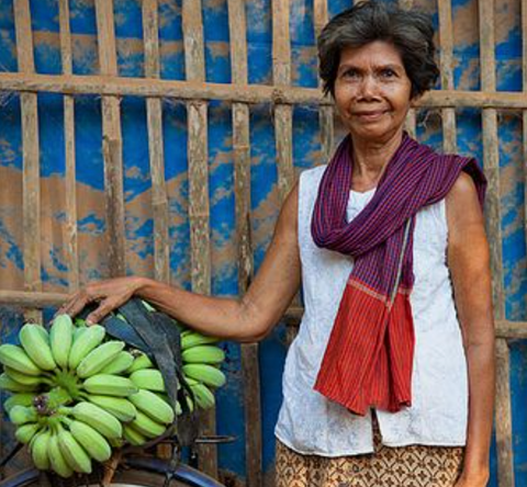 old lady Cambodia with bananas