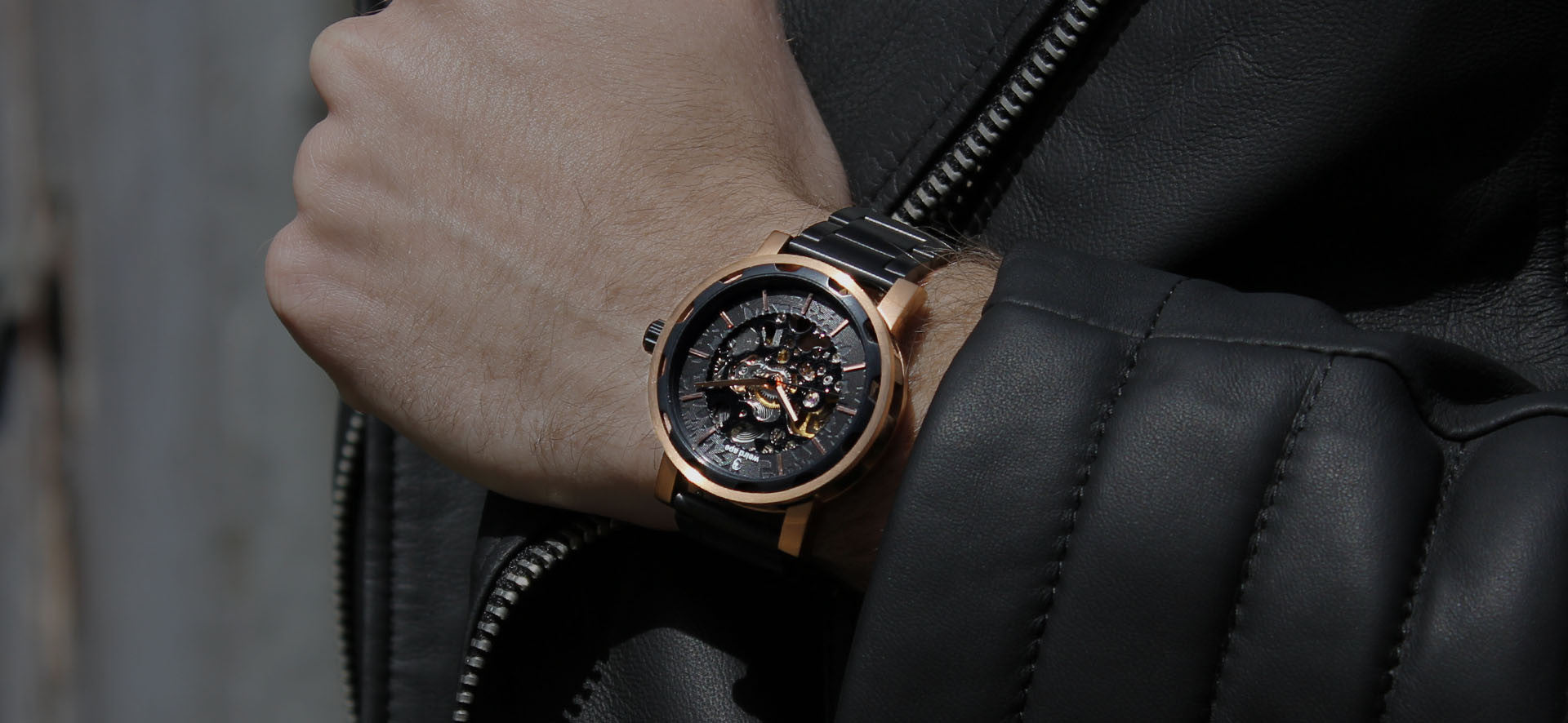 Rose gold skeleton watch with strap in a lifestyle image