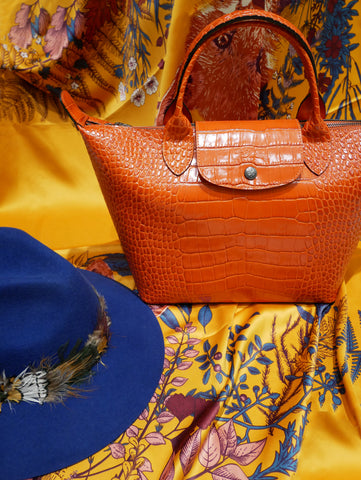 We love this bold orange Chanel - the perfect transition bag between S