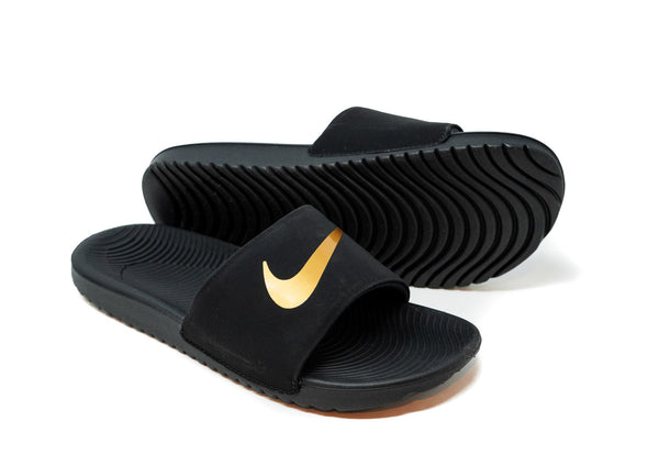 black and gold nike sliders