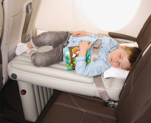 Child sleeping with book on Flyaway Kids Bed