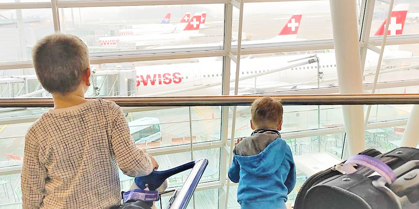 children looking at planes