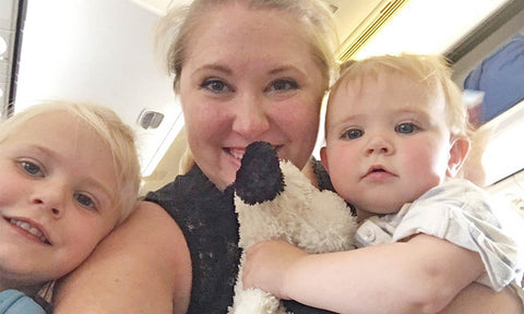 mom with two children on the plane