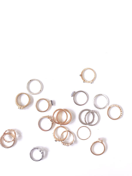a flatlay of rings on a white background
