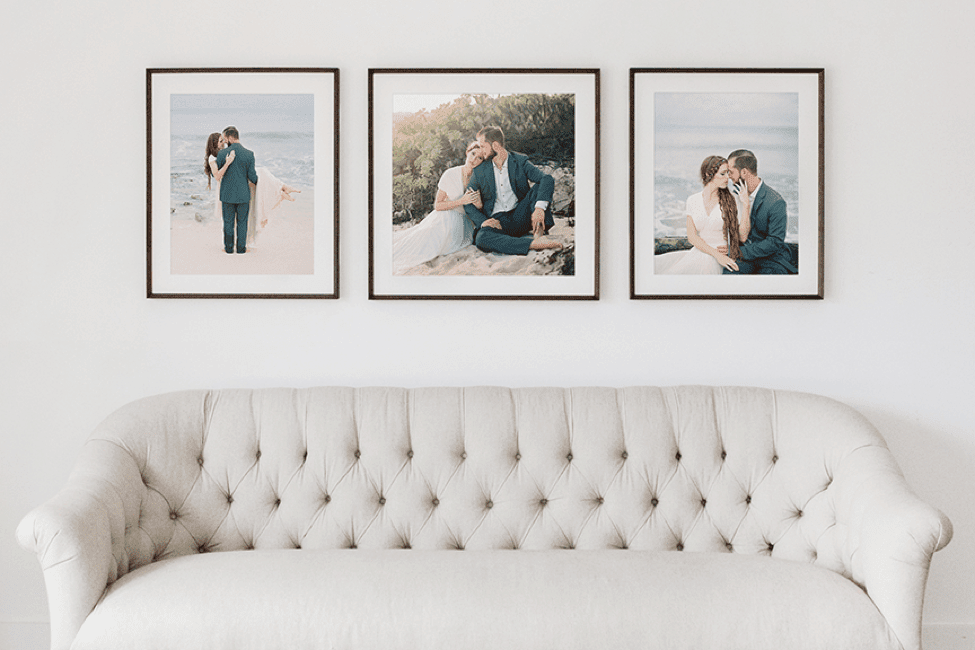 A living room area with wall frames displayed