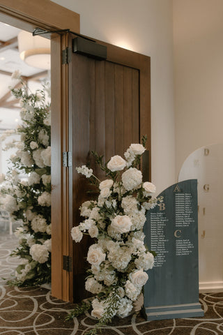 Wedding and event flowers in Fargo, North Dakota white rose pillars lush wedding flowers