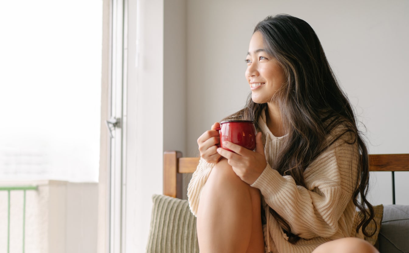 Relaxed woman drinking a cup of tea