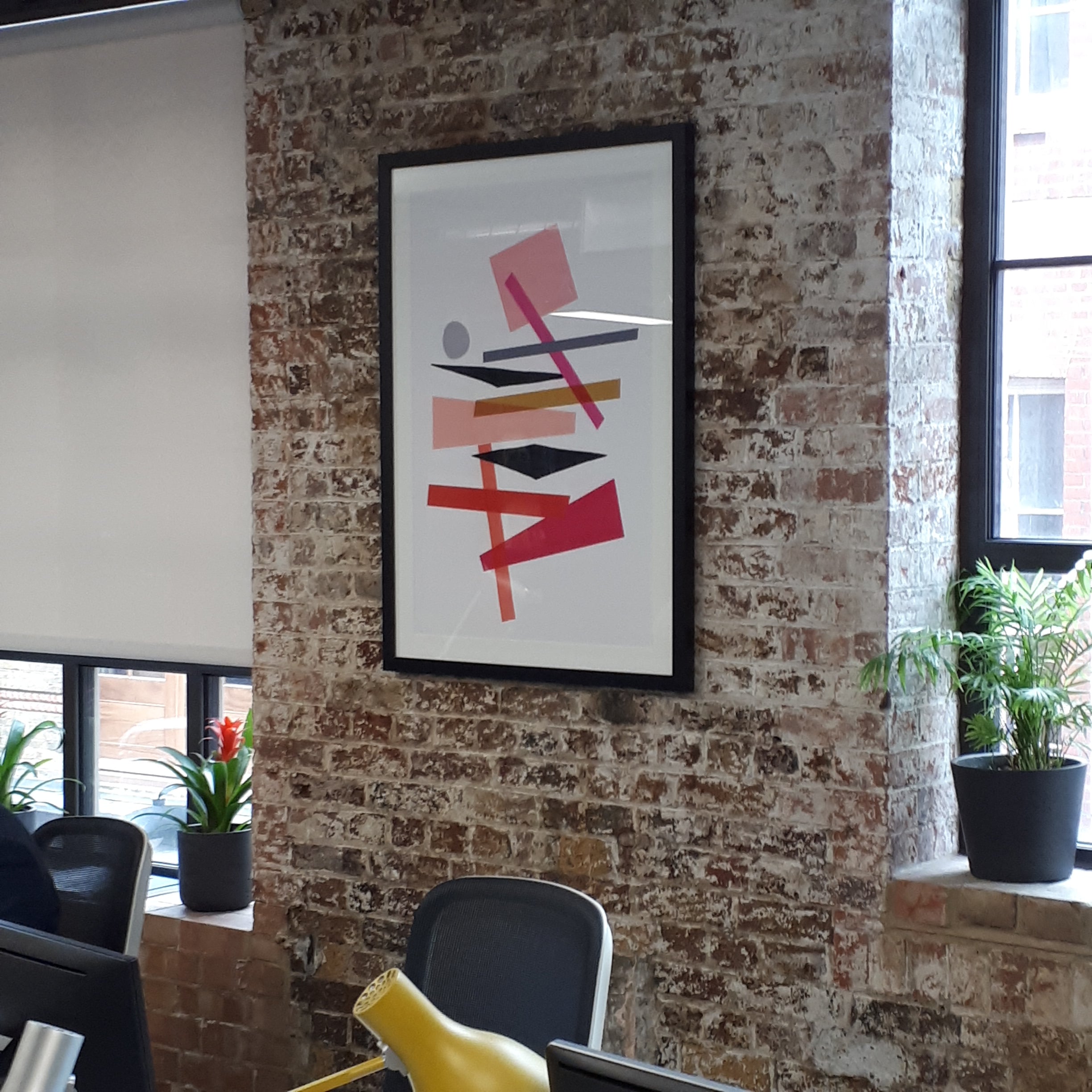 office art installed on brick wall