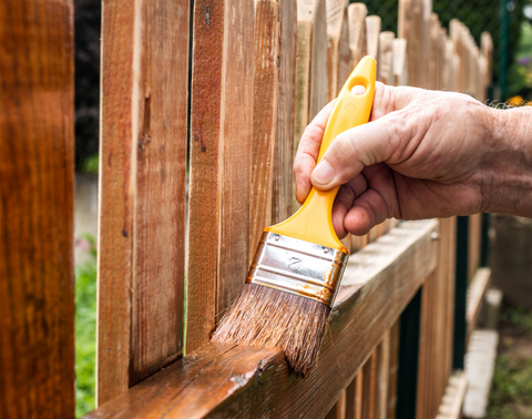 Staining a fence 