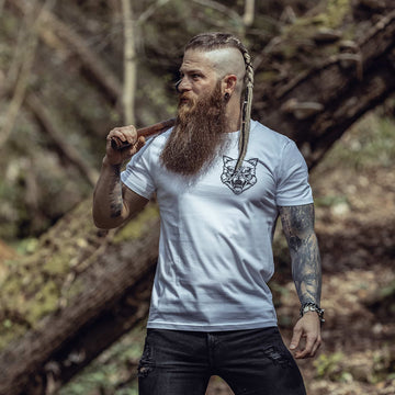 A Striking Viking Man Posing in His White Norse Inspired Tshirt