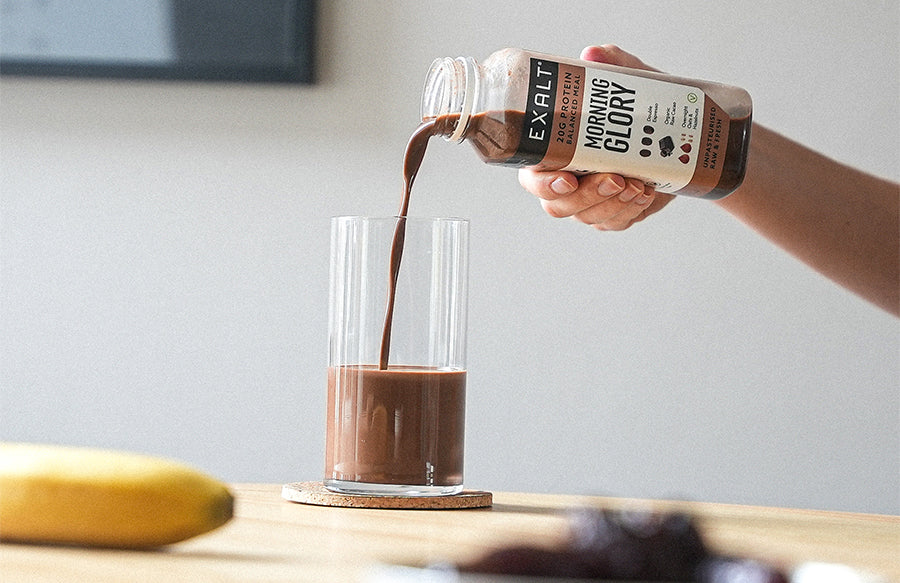 Pouring an EXALT protein smoothie