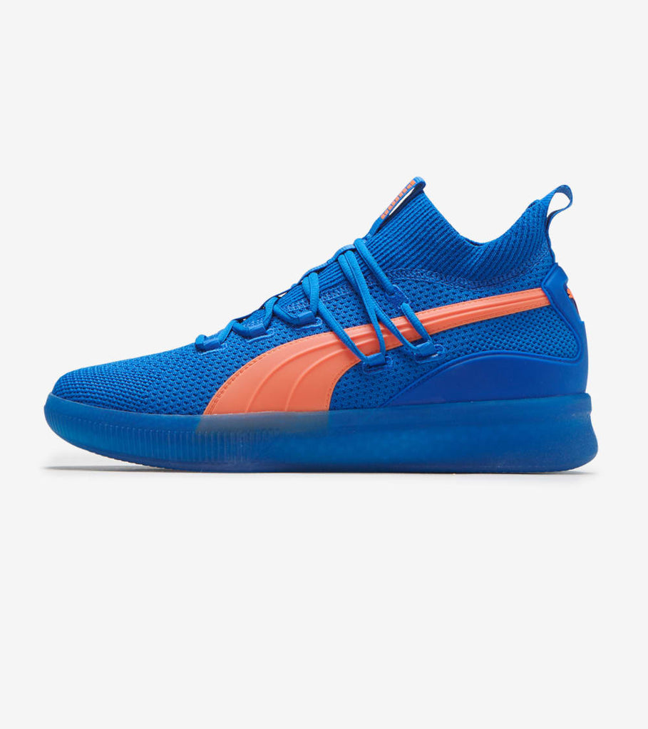 blue and orange puma shoes