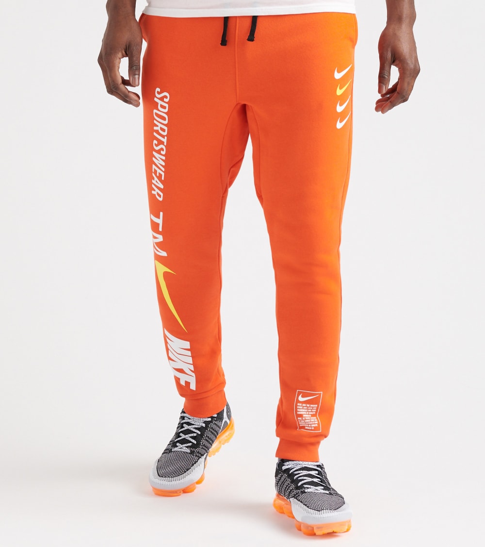 orange nike jogging pants