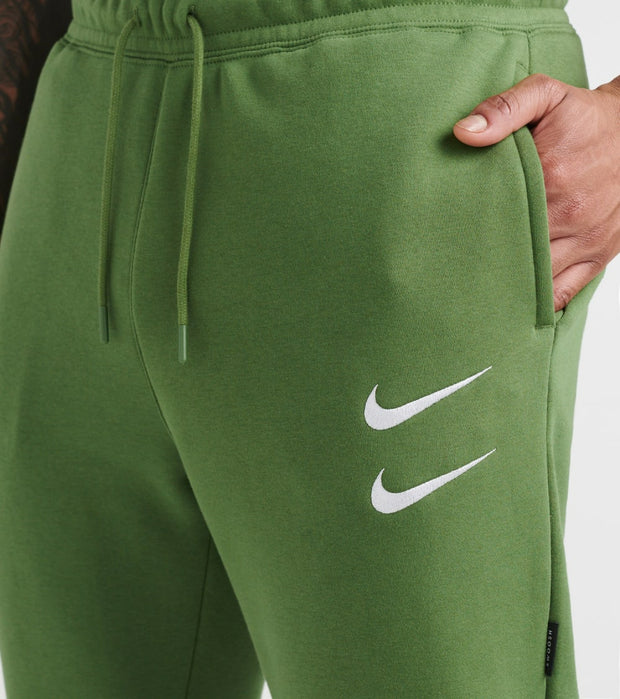 nike swoosh pants green