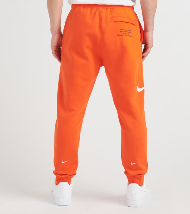 orange and white nike sweatsuit