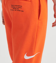 nike swoosh pants orange