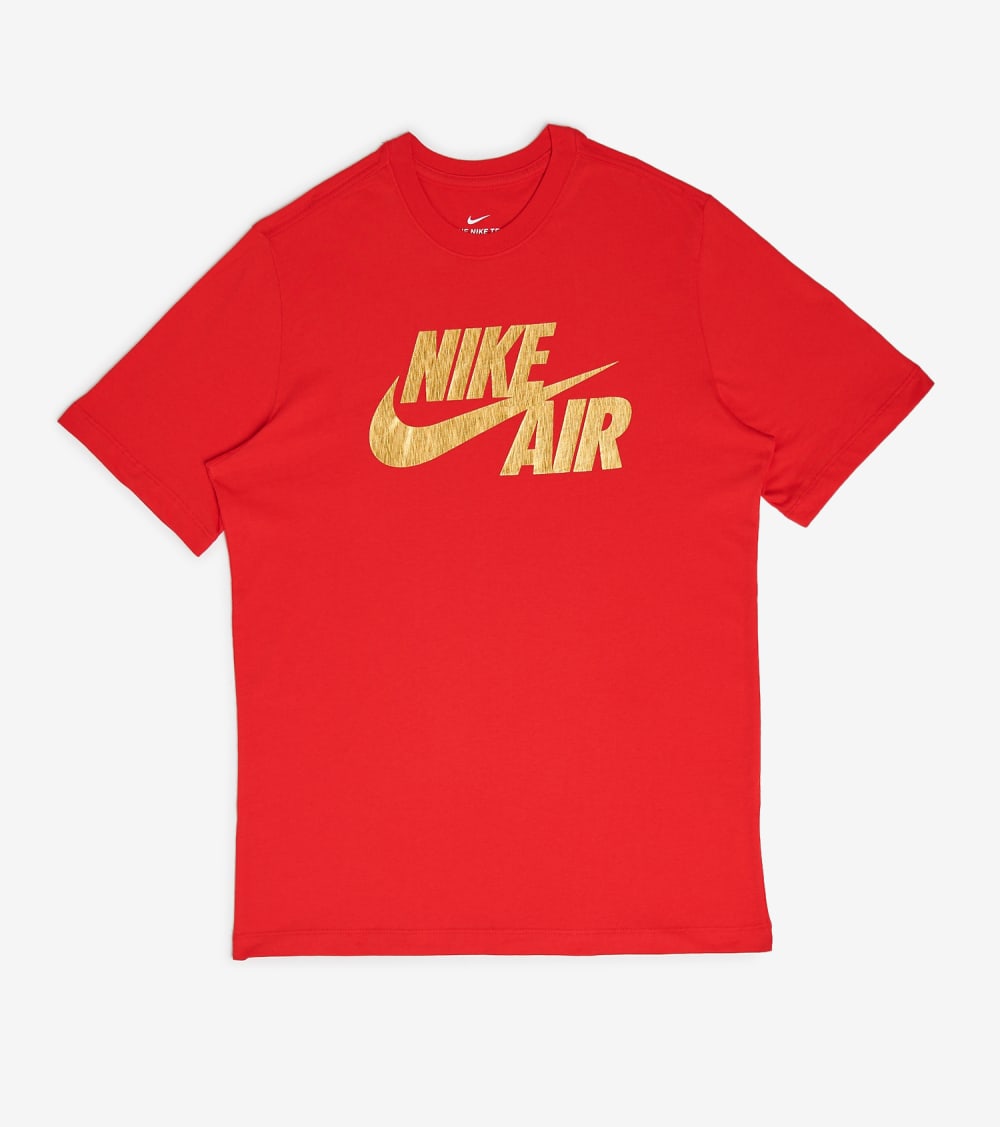 gold and red nike shirt