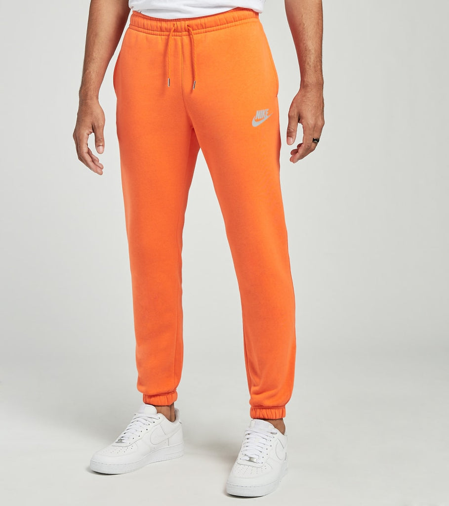 orange nike jogging pants