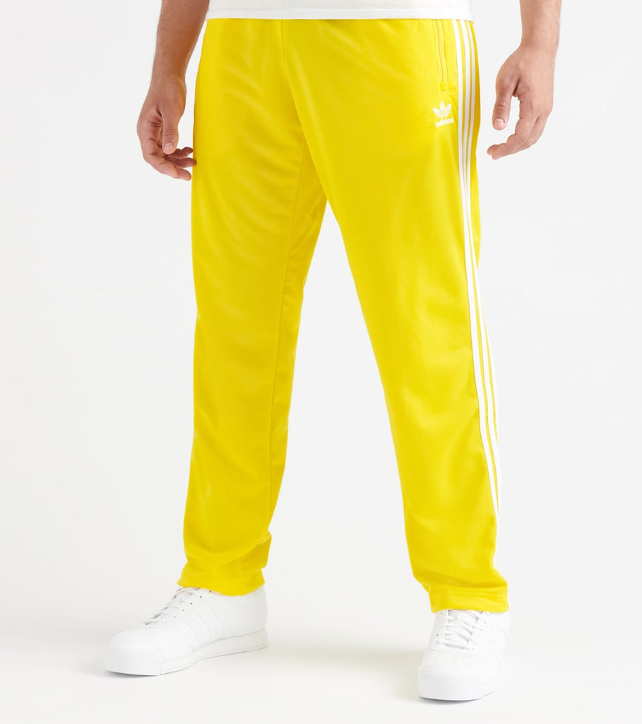 yellow adidas firebird track pants