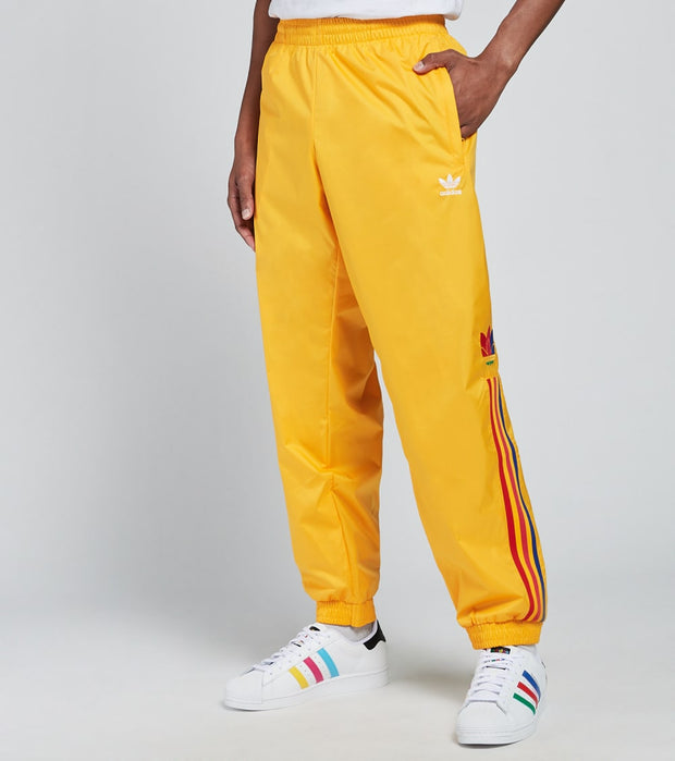 adidas track pants yellow stripe