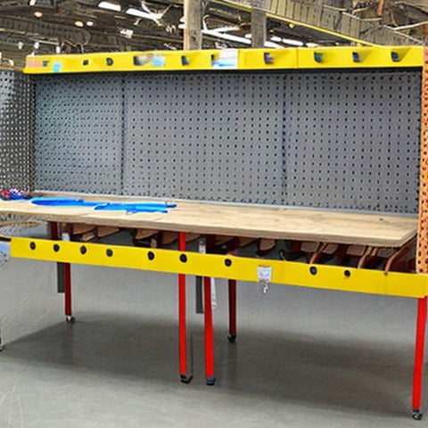 industrial assembly table with pegboard for storage and organization of small items and assembly parts