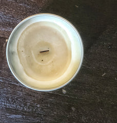 photo shows picture of an improperly burned soy wax candle where the wax has formed a tunnel. 