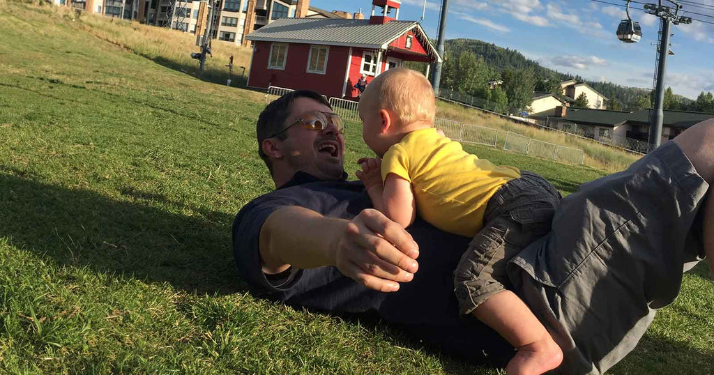 dad bonding with baby outside