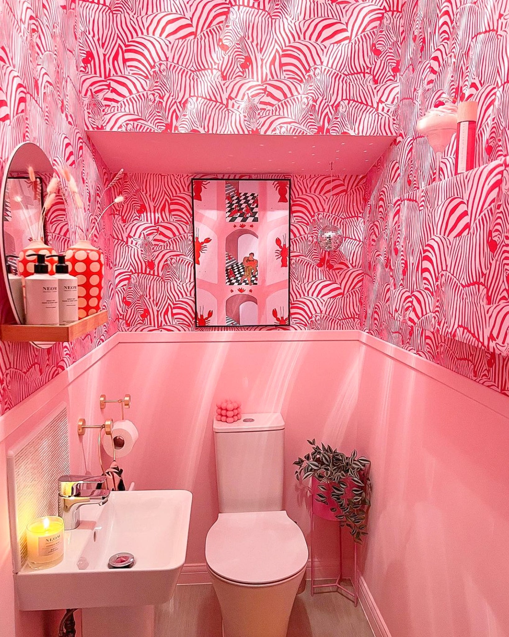 Hide and Seek Wallpaper in Red and Pink bathroom @letsgotopoppys.jpg__PID:f9778201-7b8a-47d8-8dd2-ecab08c69756
