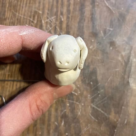 Homeschool science craft project making lamb ornament of clay with face