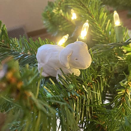 Homeschool science craft project making lamb ornament of clay in a Christmas tree