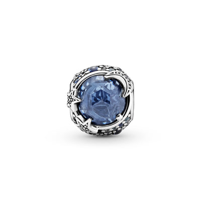 Back side of Pandora Celestial Blue Sparkling Stars Charm hand-finished in sterling silver. The rounded design includes a large blue stone in the center that’s encircled by blue and clear stones in various sizes. Beaded stars overlap the central stone for added texture.