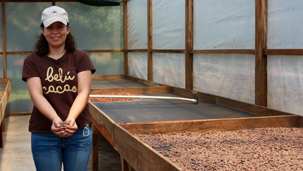 Belu Cacao - Emily with dried, fermented cacao in drying center, El Salvador