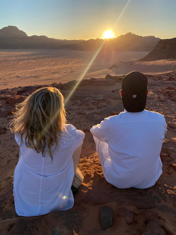 watching sunset, Tara Riceberg seated next to guide, Wadi Rum, Jordan