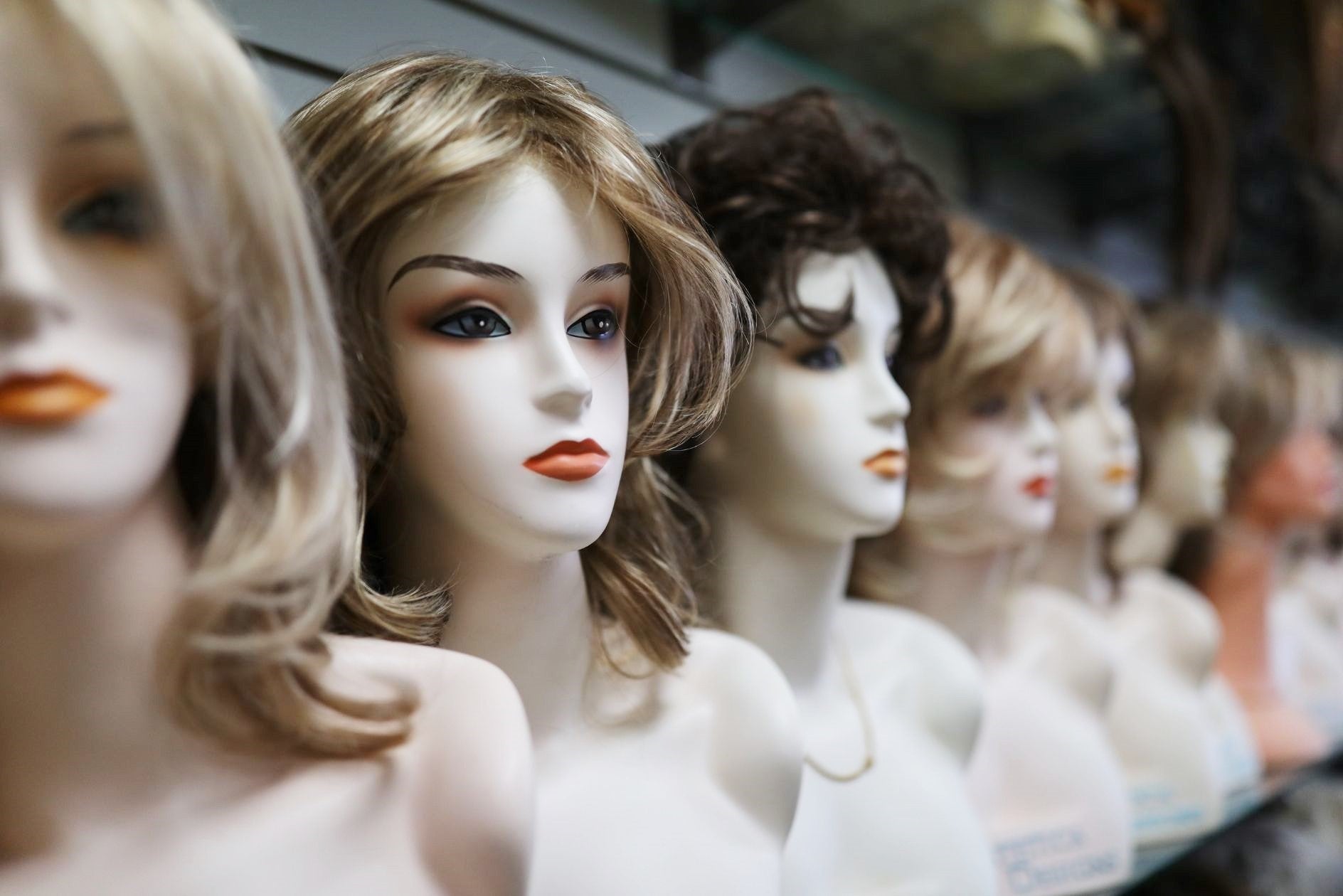 variety of wigs displayed at wig avenue in austin tx