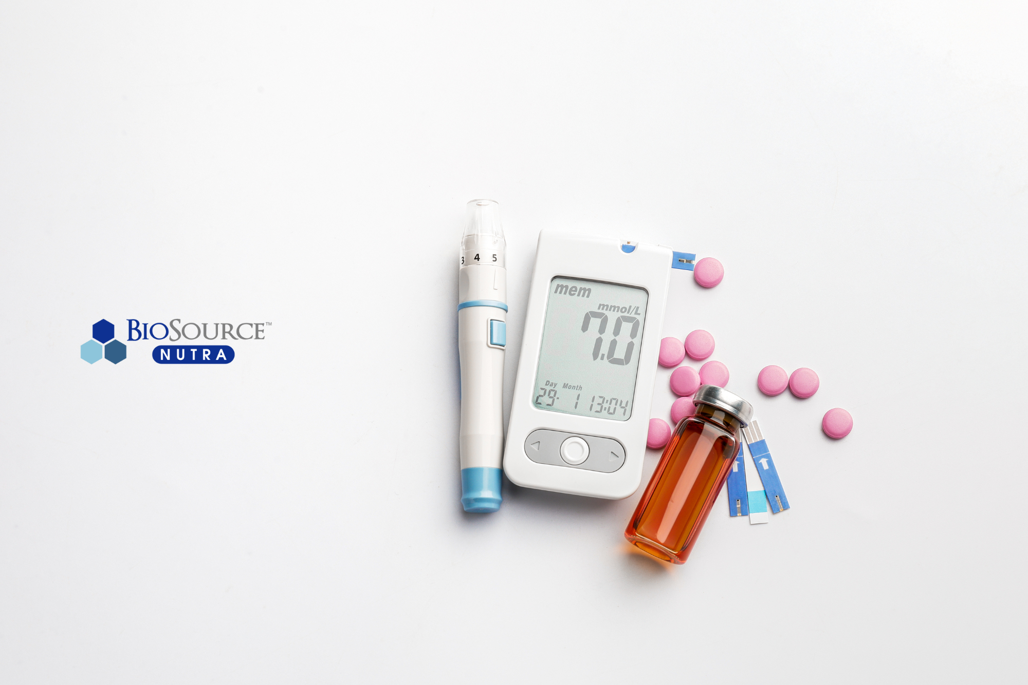 A white glucometer surrounded by medications