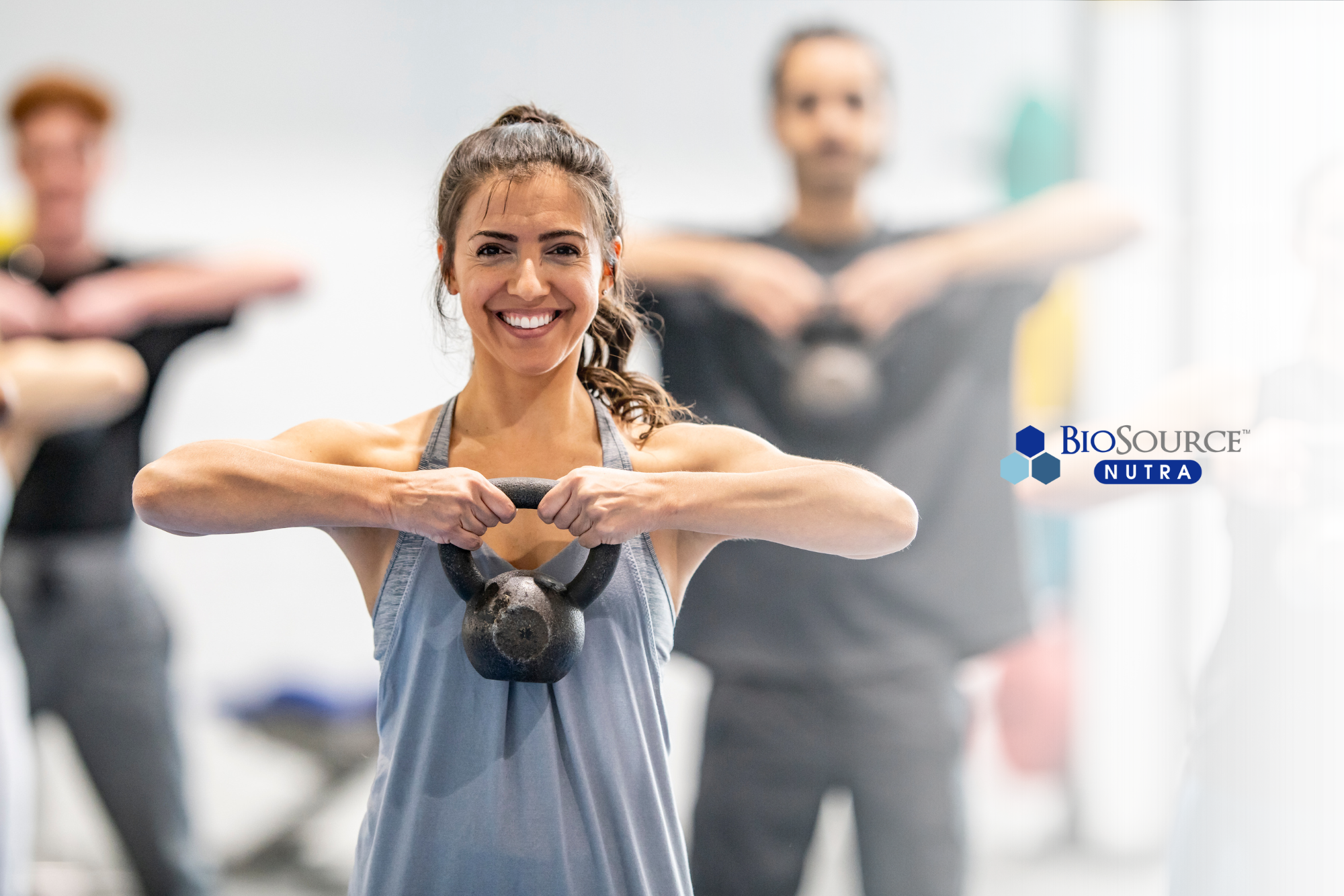 A woman works out with a kettlebell weight