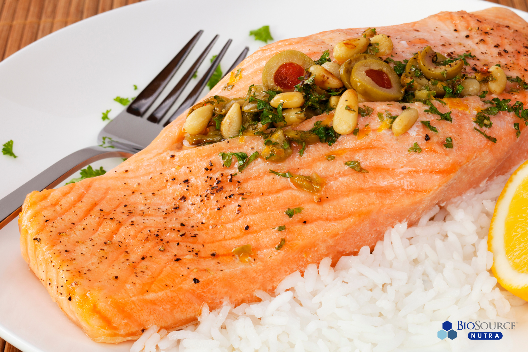 A salmon fillet on a bed of white rice