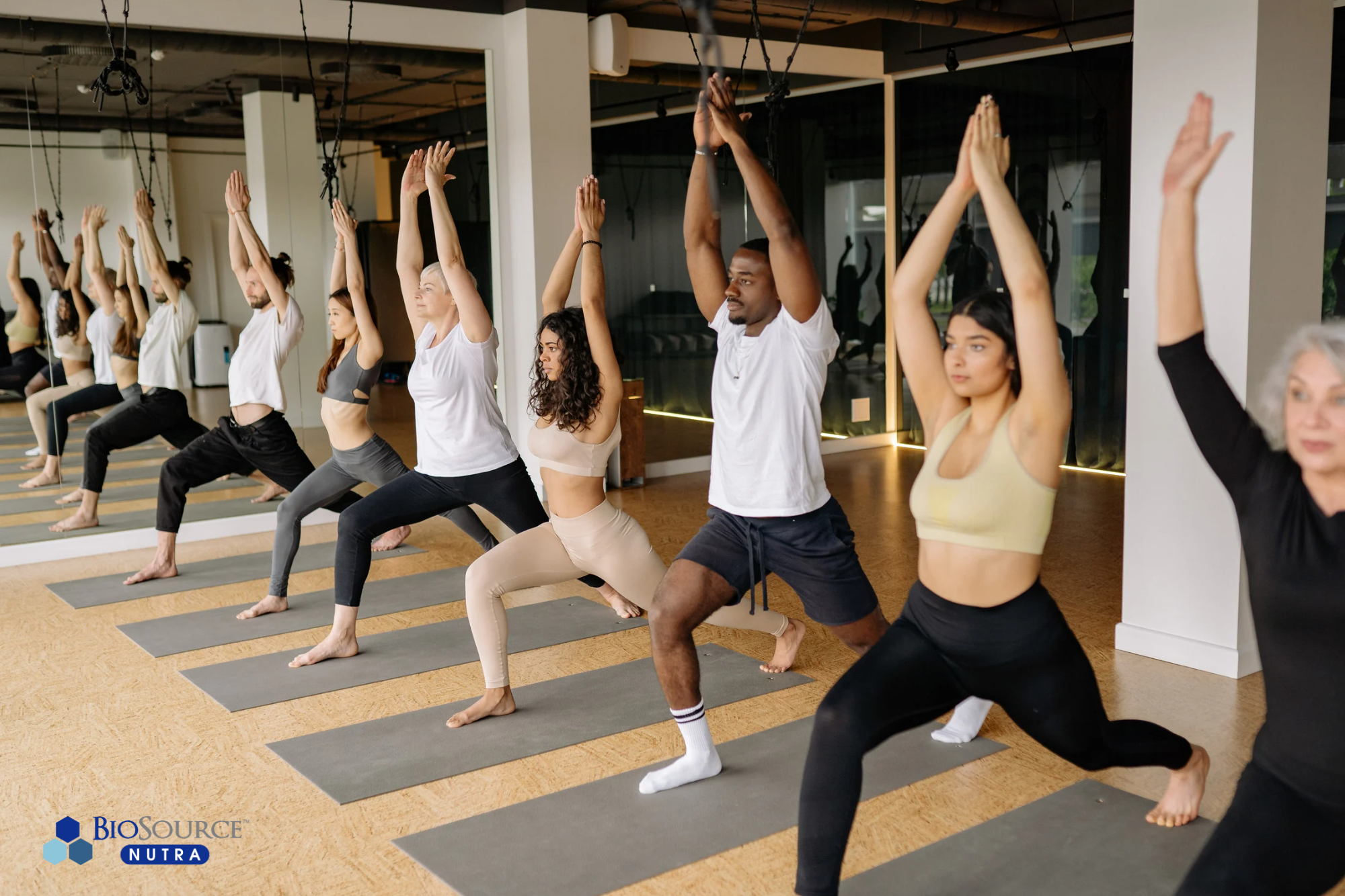 A group of people perform yoga exercises
