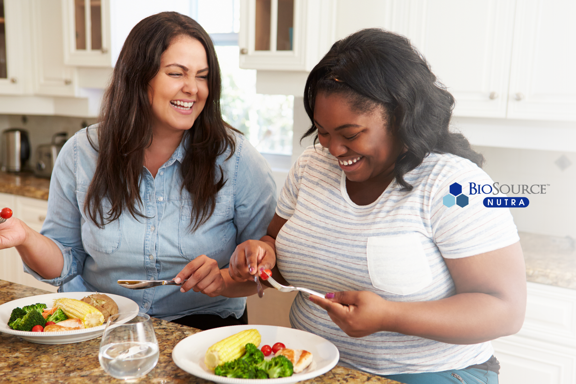 Two young women enjoy sharing a meal together