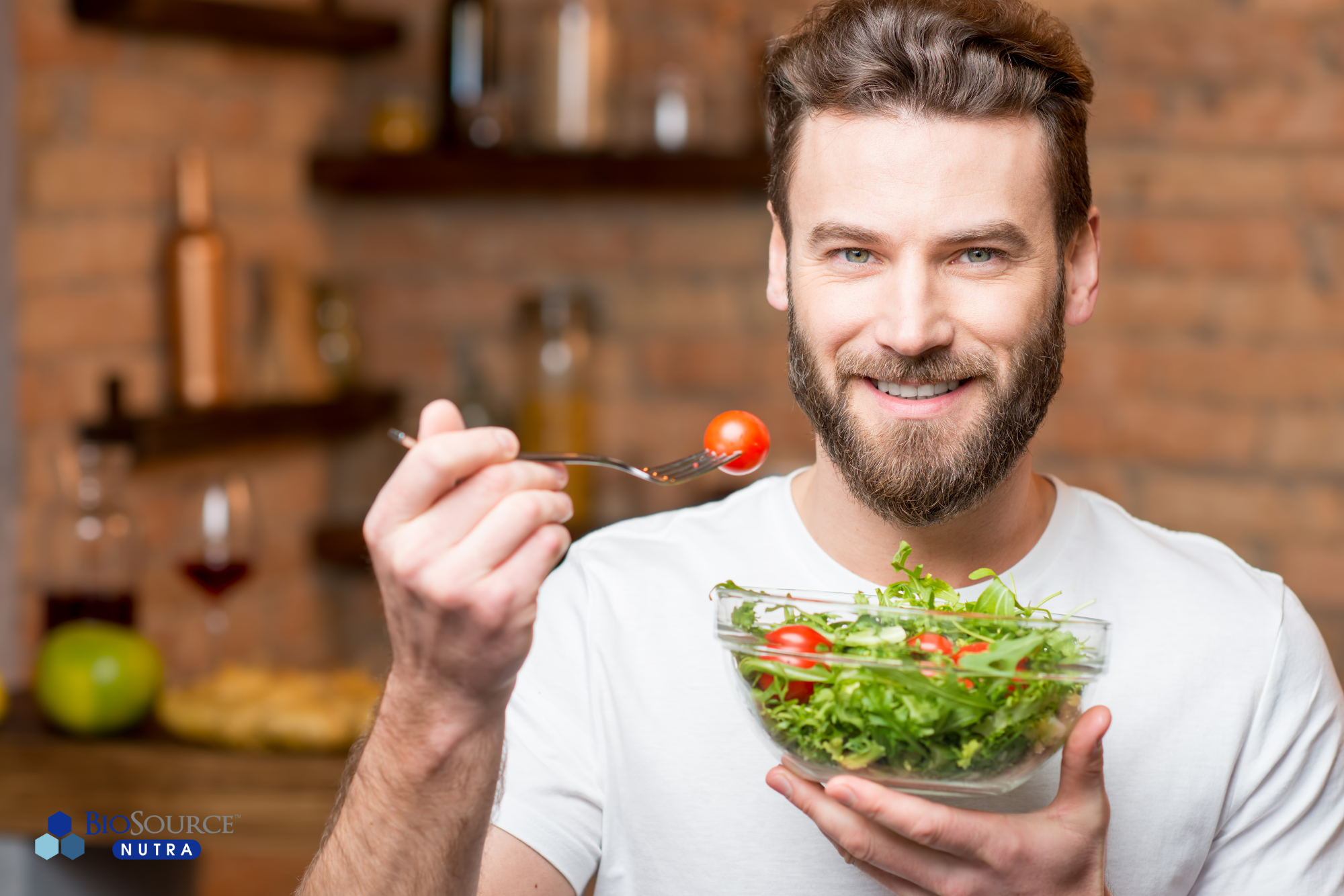 A man enjoys a leafy green salad