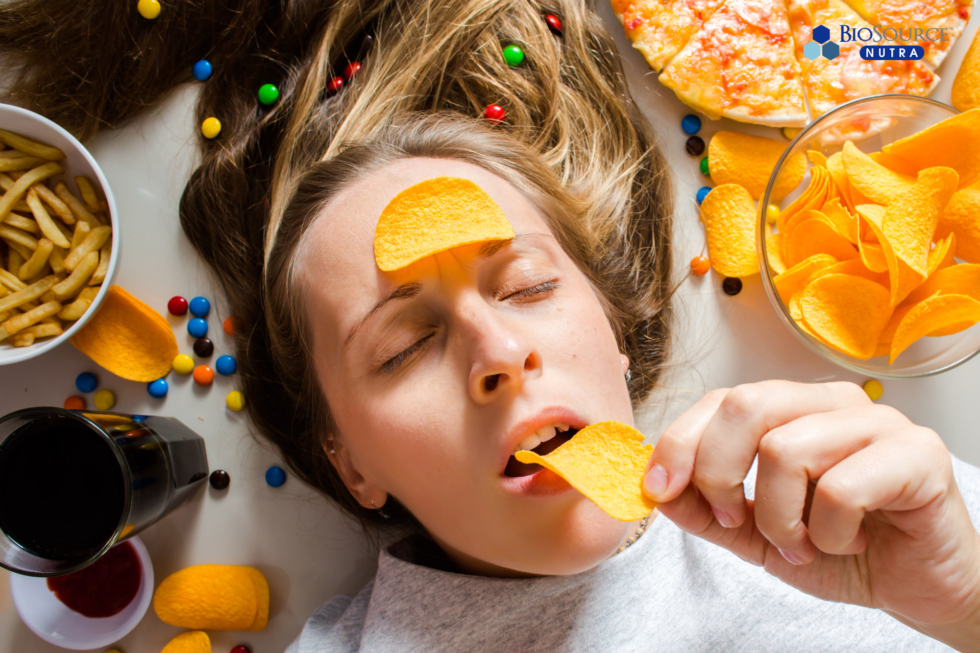 A woman binge-eating processed foods