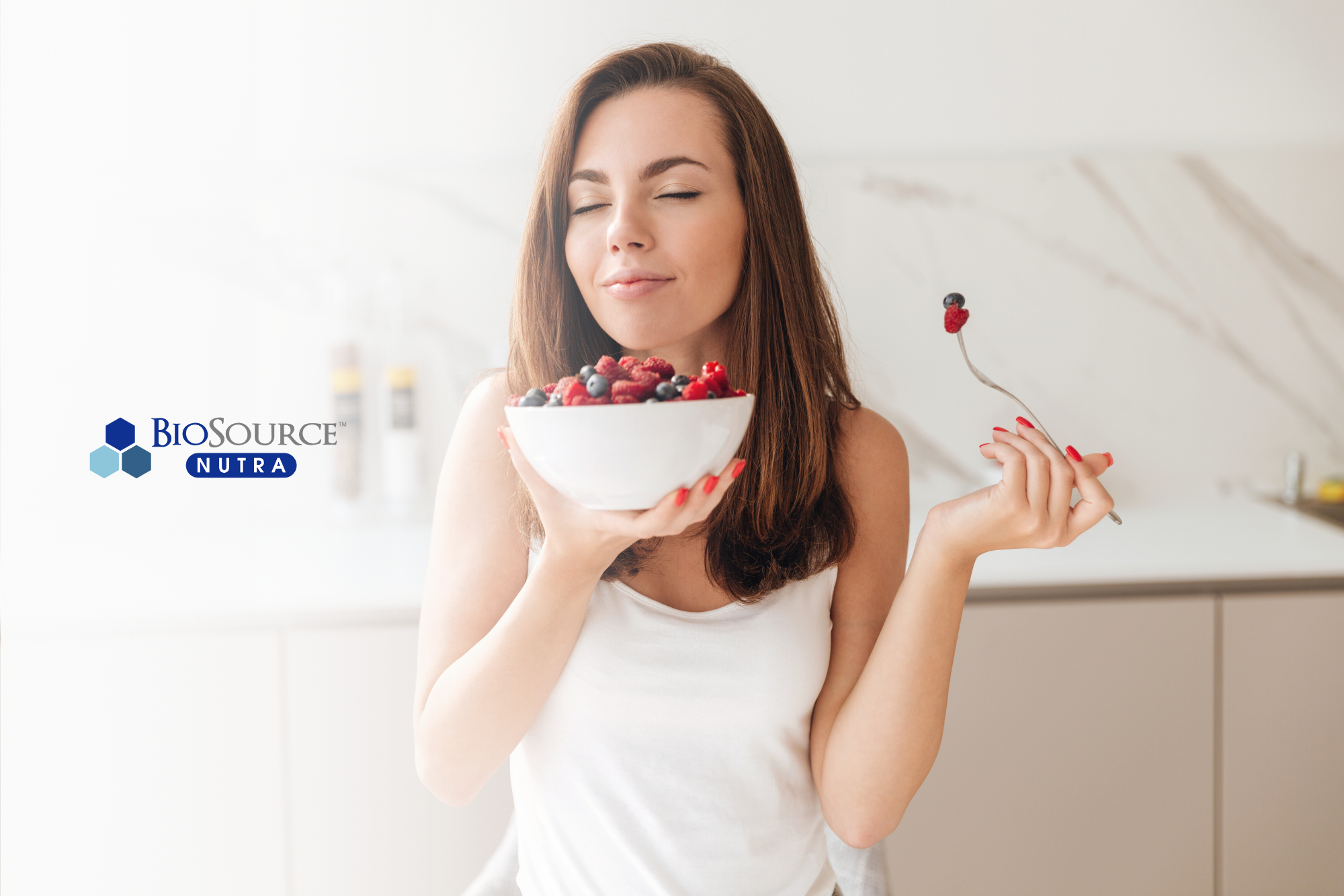 A young woman enjoys a breakfast of berries and oats