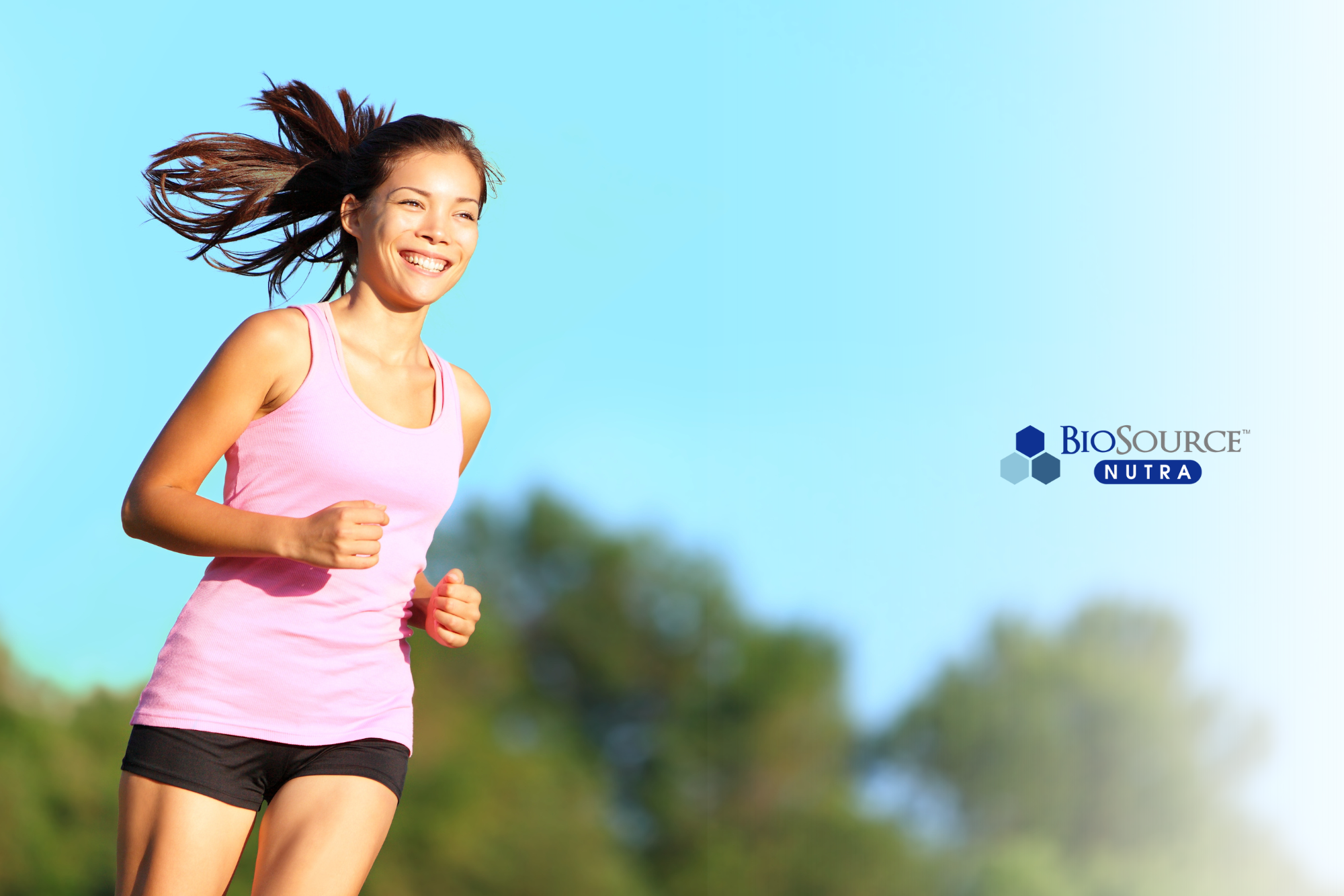A young woman enjoys a run in the sunshine