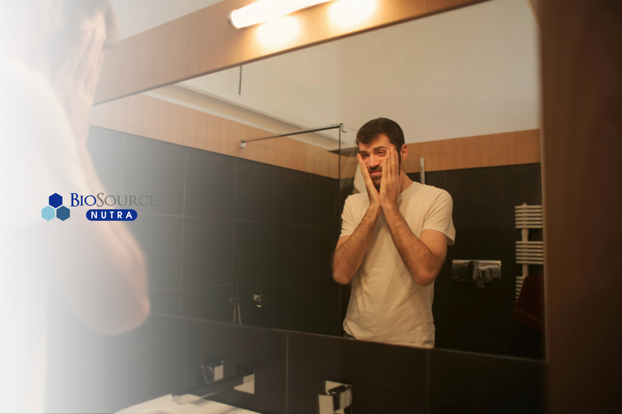 A young man stares at his exhausted reflection