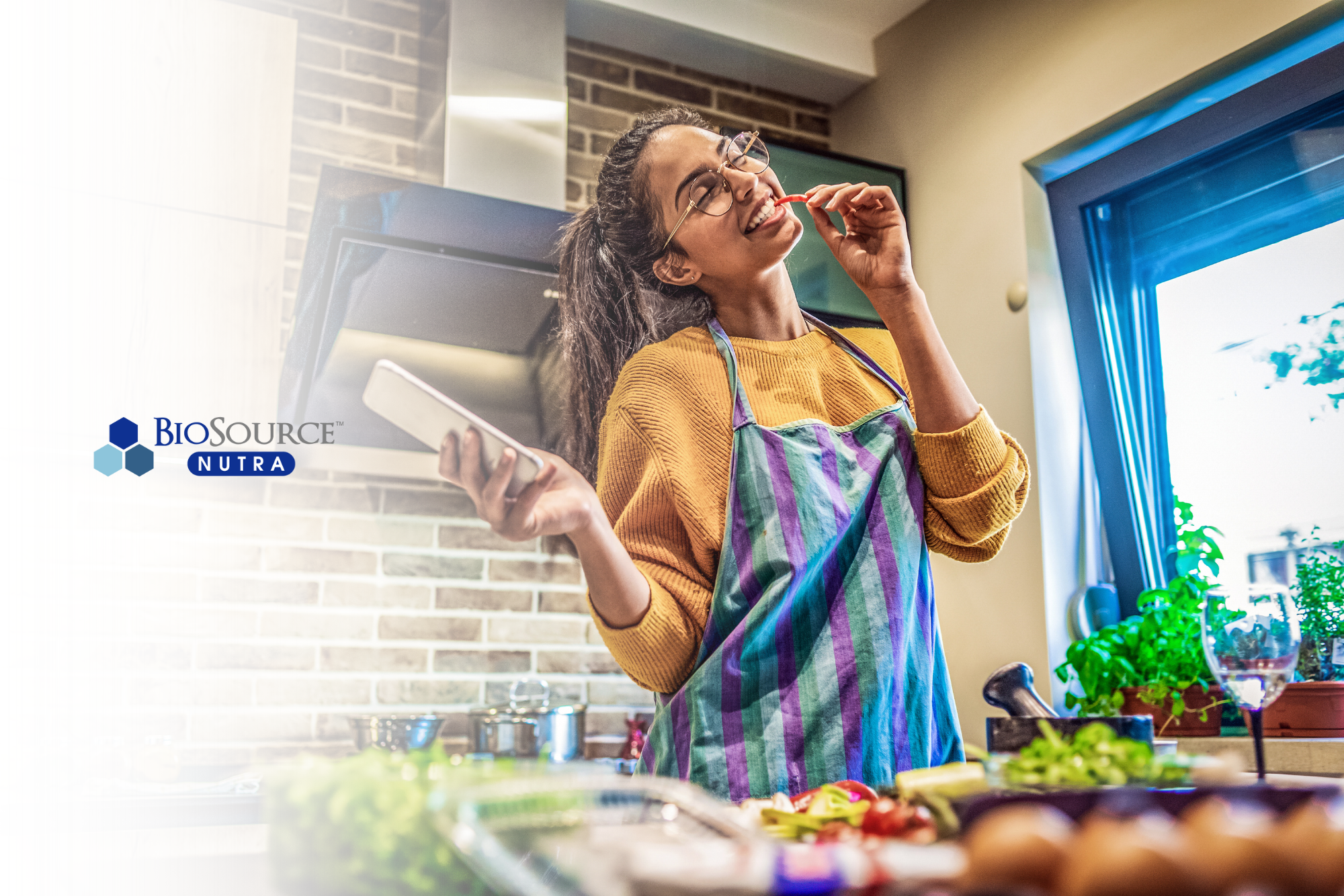 A young woman dances as she cooks her dinner.