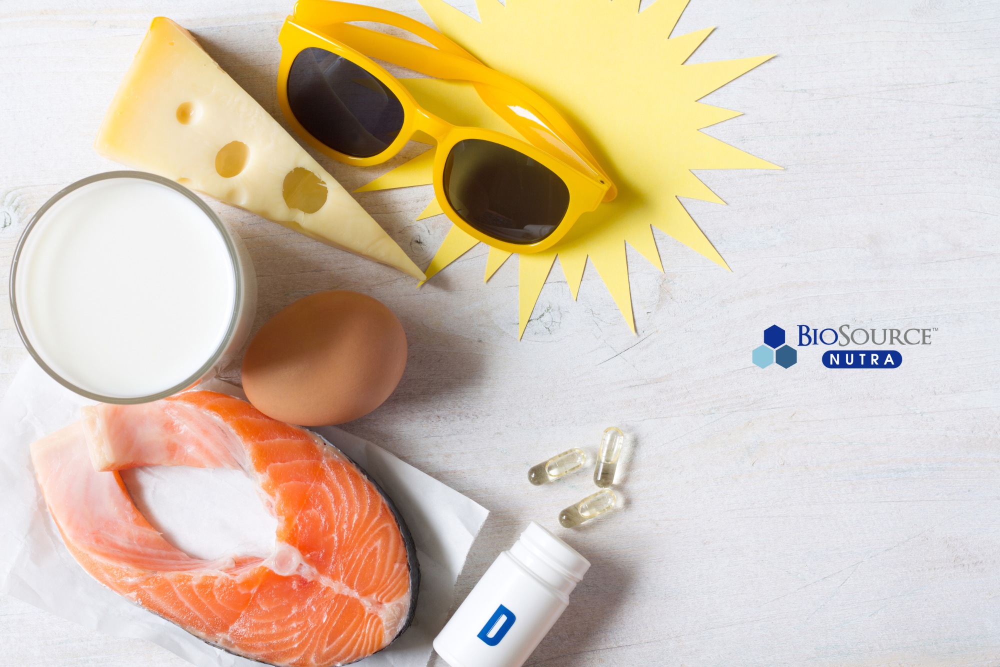 A variety of foods rich in vitamin D, including milk, cheese, and salmon