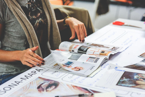 Girl reading a fashion magazine